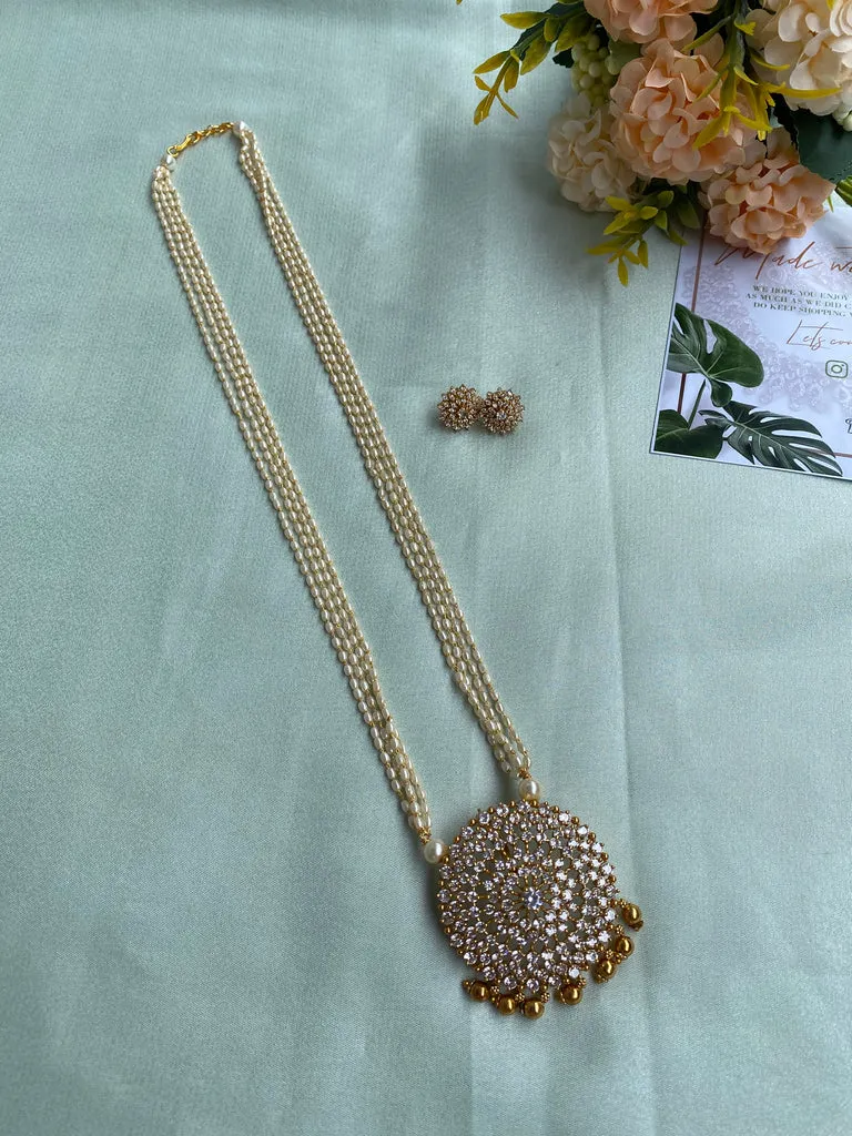 AD Pearl Haram with earrings